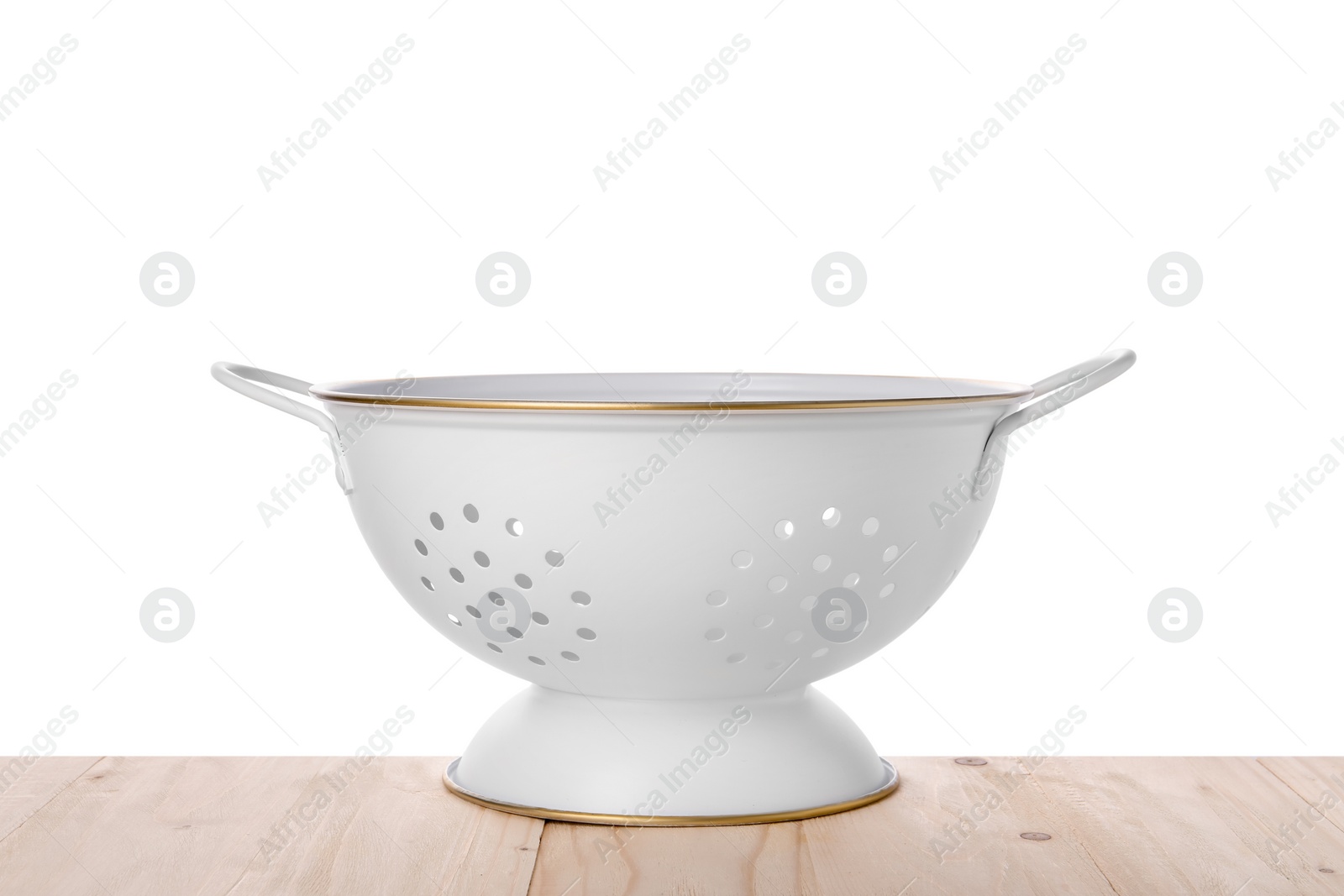 Photo of One empty colander on wooden table against white background