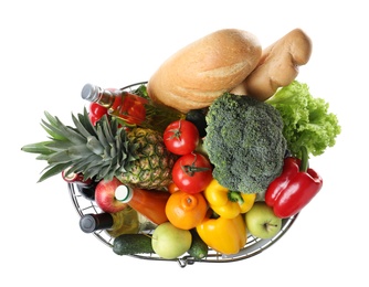 Photo of Shopping basket with grocery products on white background, top view