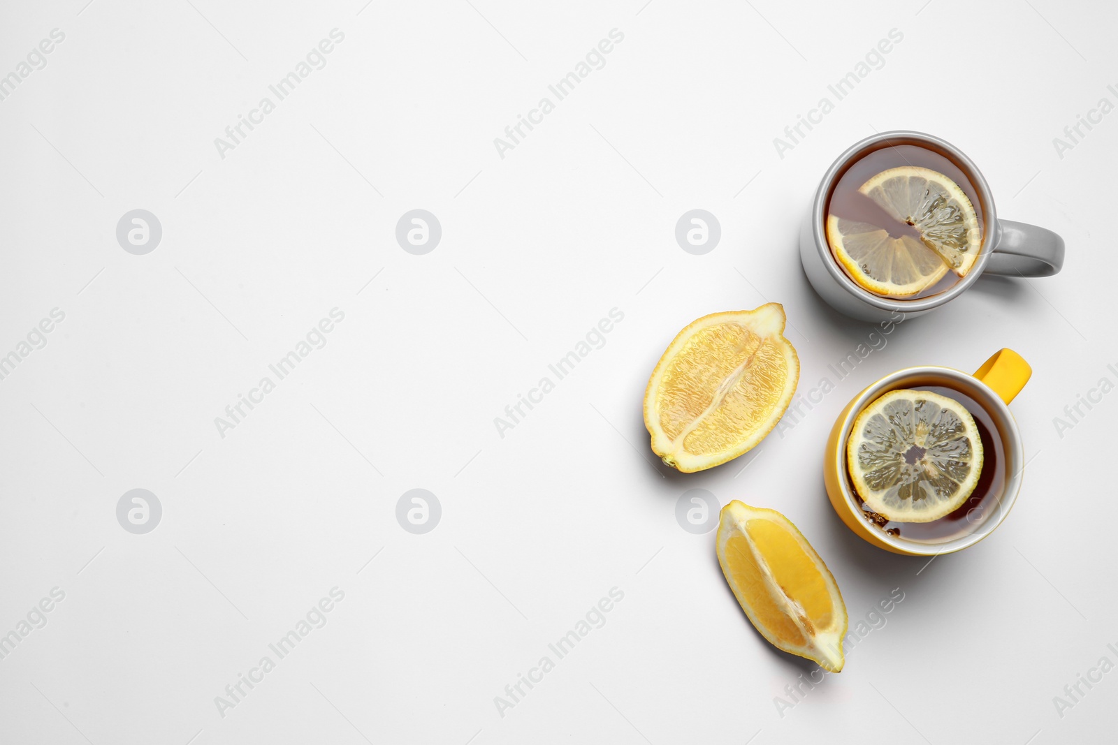 Photo of Composition with lemon tea on white background, top view. Space for text