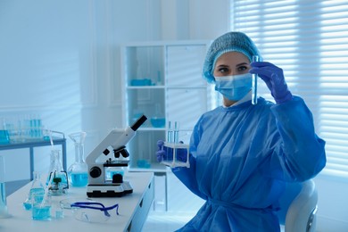 Photo of Scientist working with sample in laboratory, space for text. Medical research