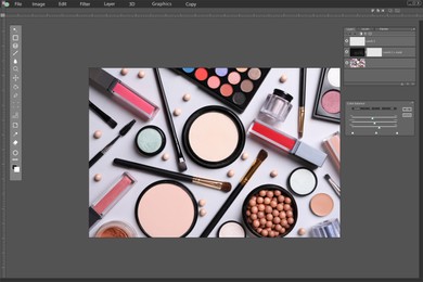 Professional photo editor application. Image of different cosmetic products on light grey background