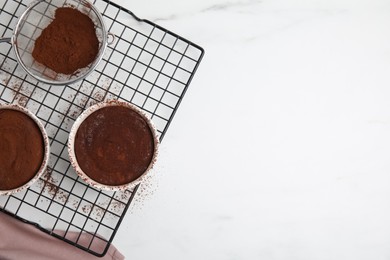 Photo of Delicious fresh chocolate fondant on white table, flat lay. Space for text