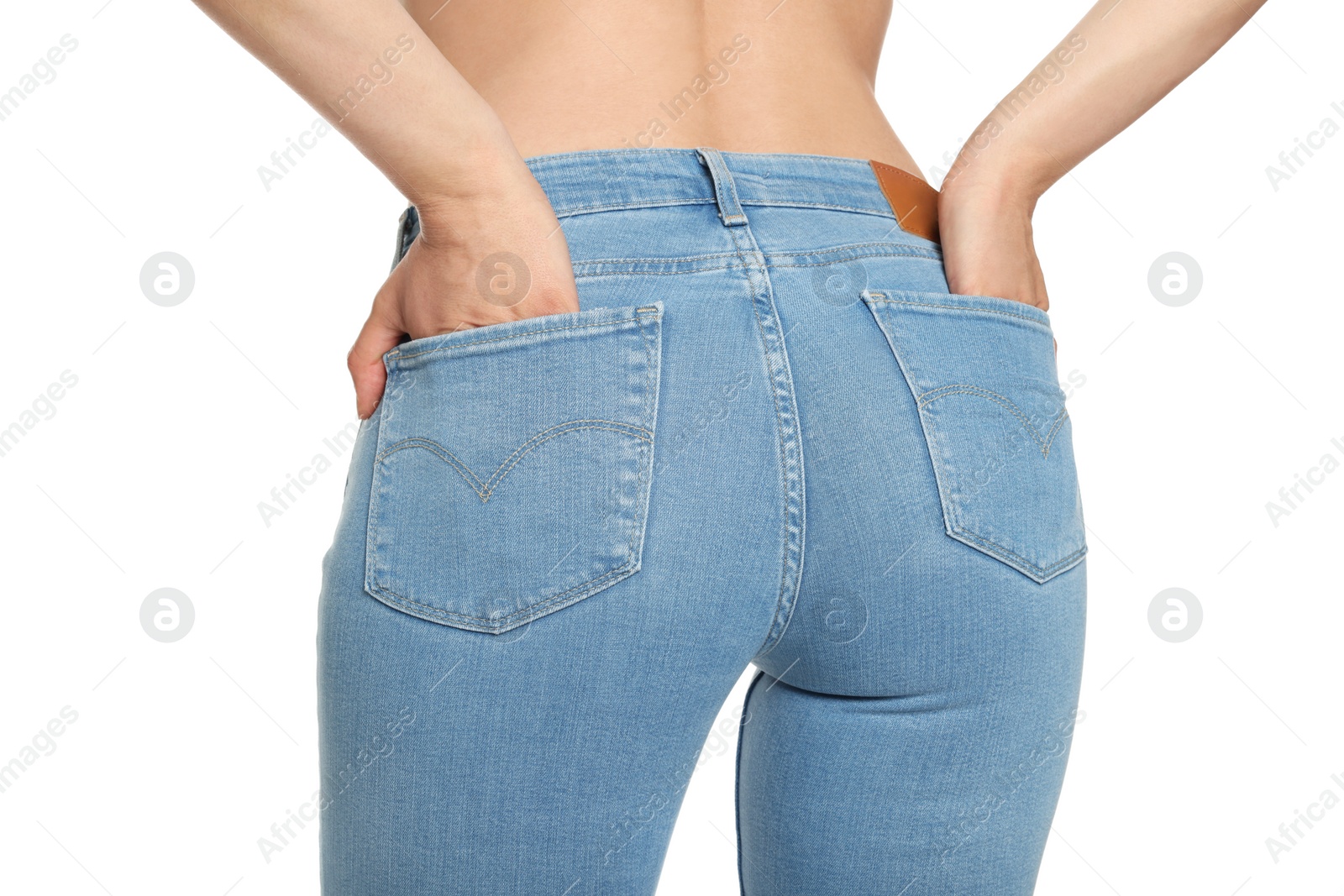 Photo of Woman wearing stylish light blue jeans on white background, closeup