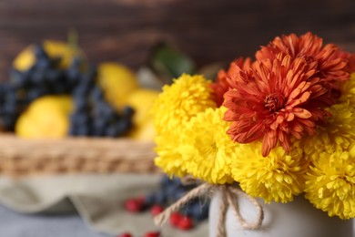 Bouquet of beautiful chrysanthemum flowers on table, closeup. Space for text