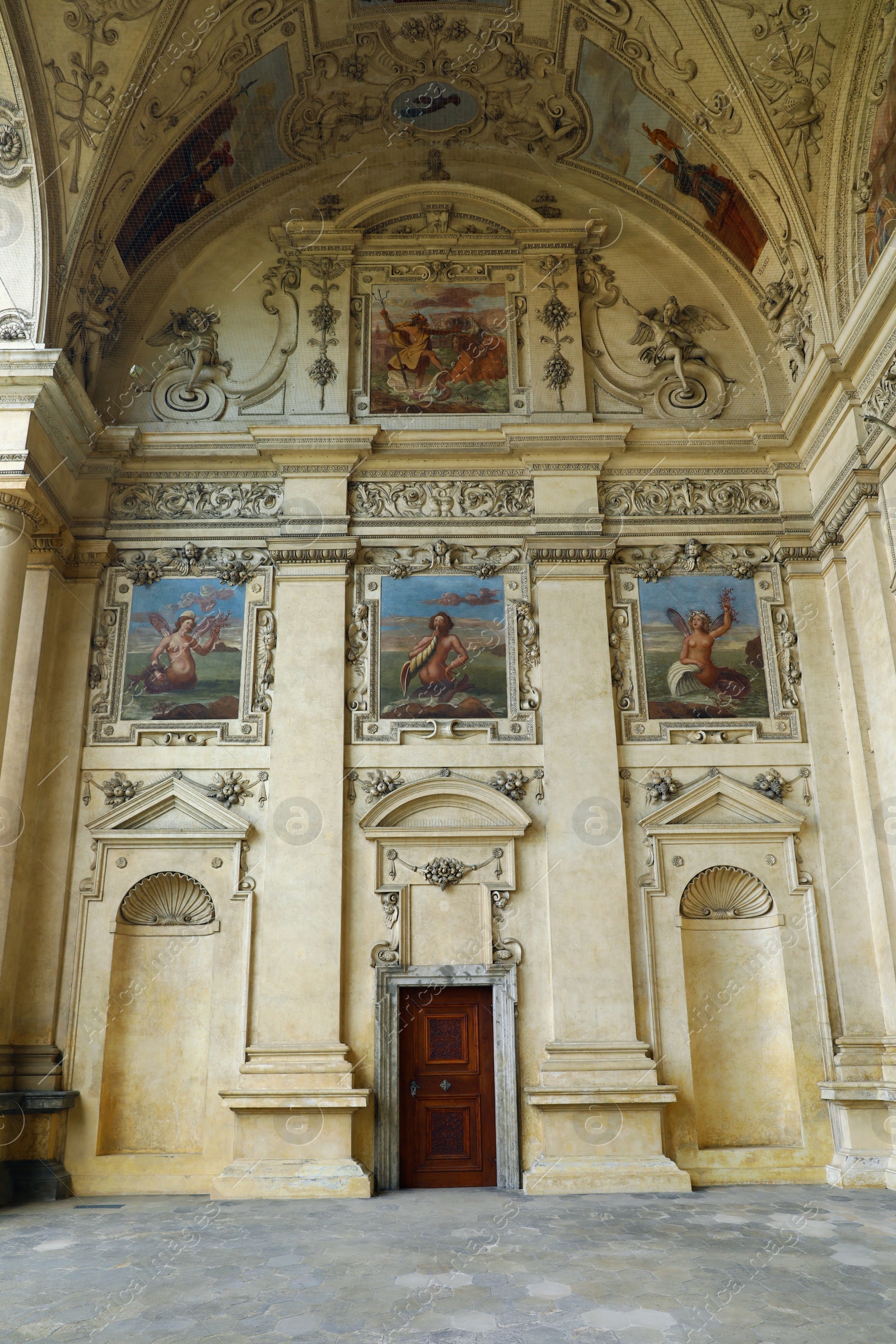 Photo of PRAGUE, CZECH REPUBLIC - APRIL 25, 2019: Sala terrena with beautiful fresco decoration in Wallenstein Palace, low angle view