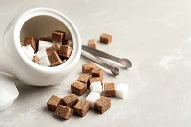 Photo of Bowl and refined sugar cubes on light table