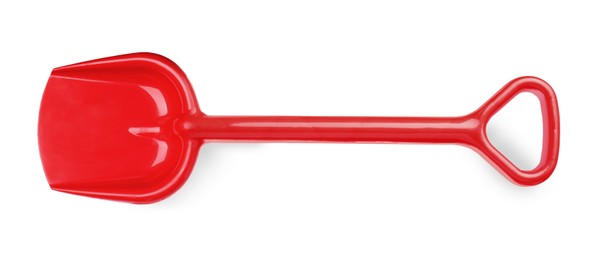 Photo of Red plastic toy shovel isolated on white, top view
