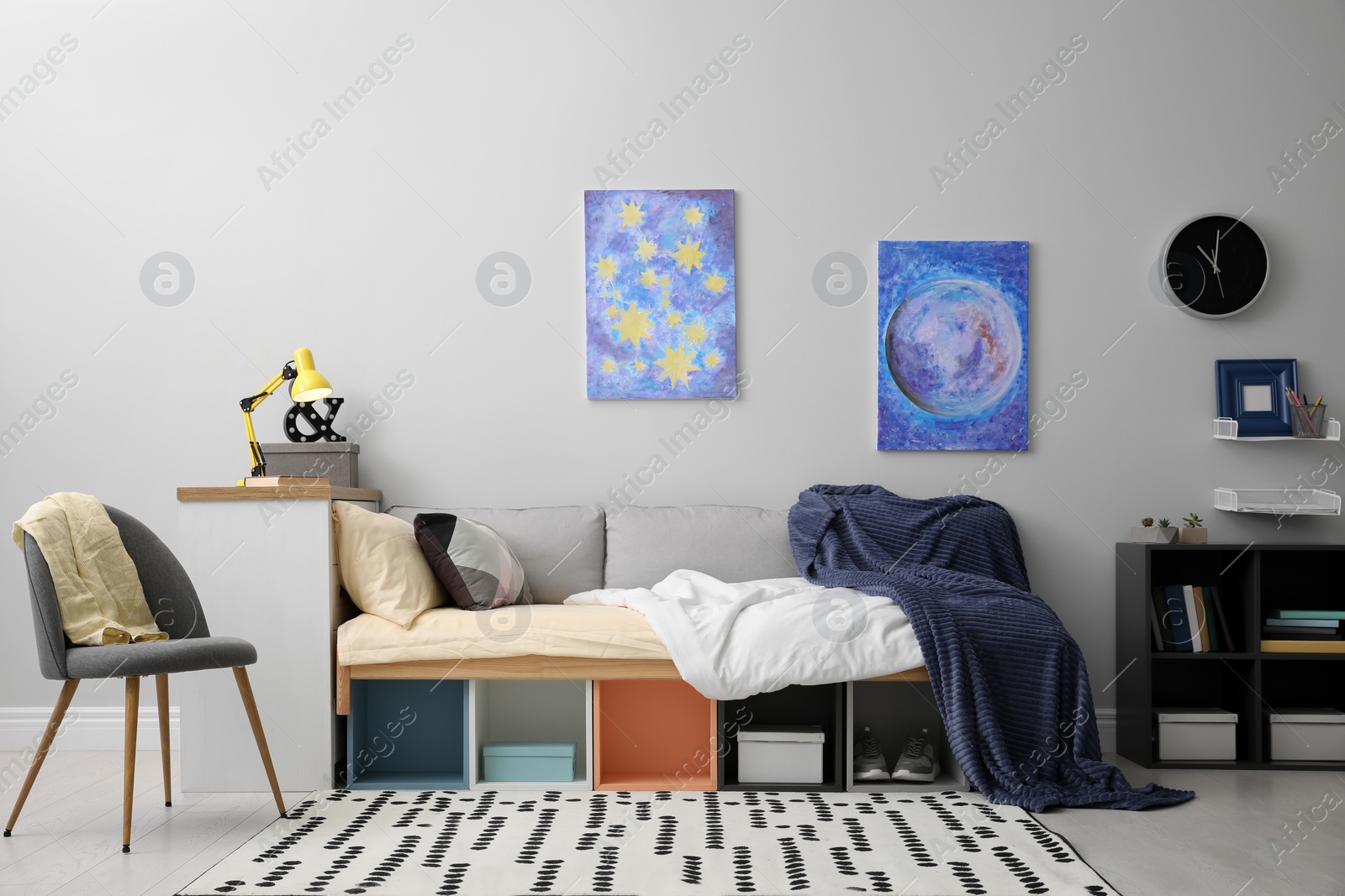 Photo of Modern teenager's room interior with comfortable bed and stylish design elements