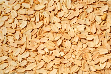 Fresh peeled peanuts as background, top view