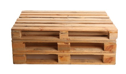 Photo of Stacked wooden pallets isolated on white. Transportation and storage