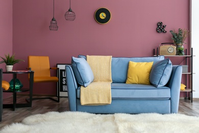 Photo of Cozy living room interior with comfortable sofa