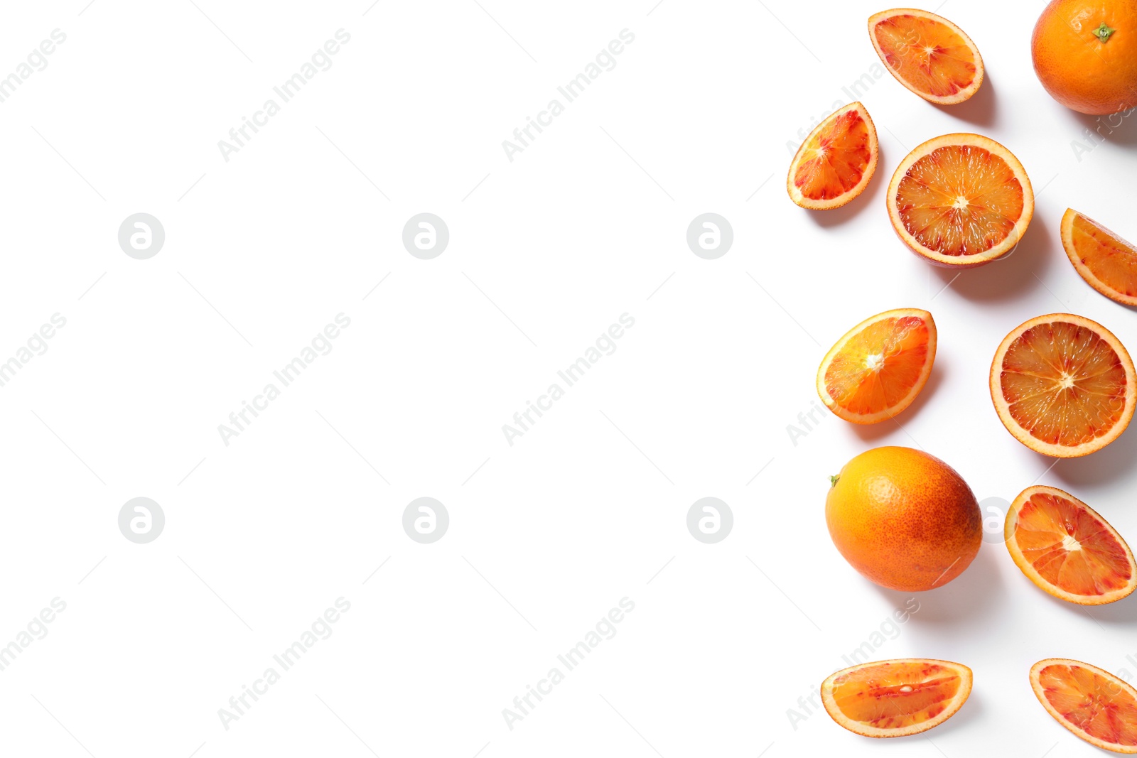 Photo of Fresh bloody oranges on white background, top view. Citrus fruits