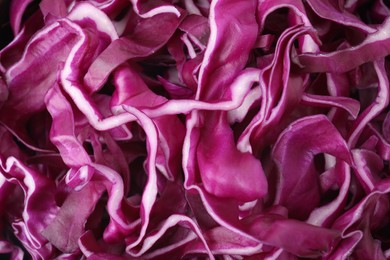 Photo of Shredded fresh red cabbage as background, top view