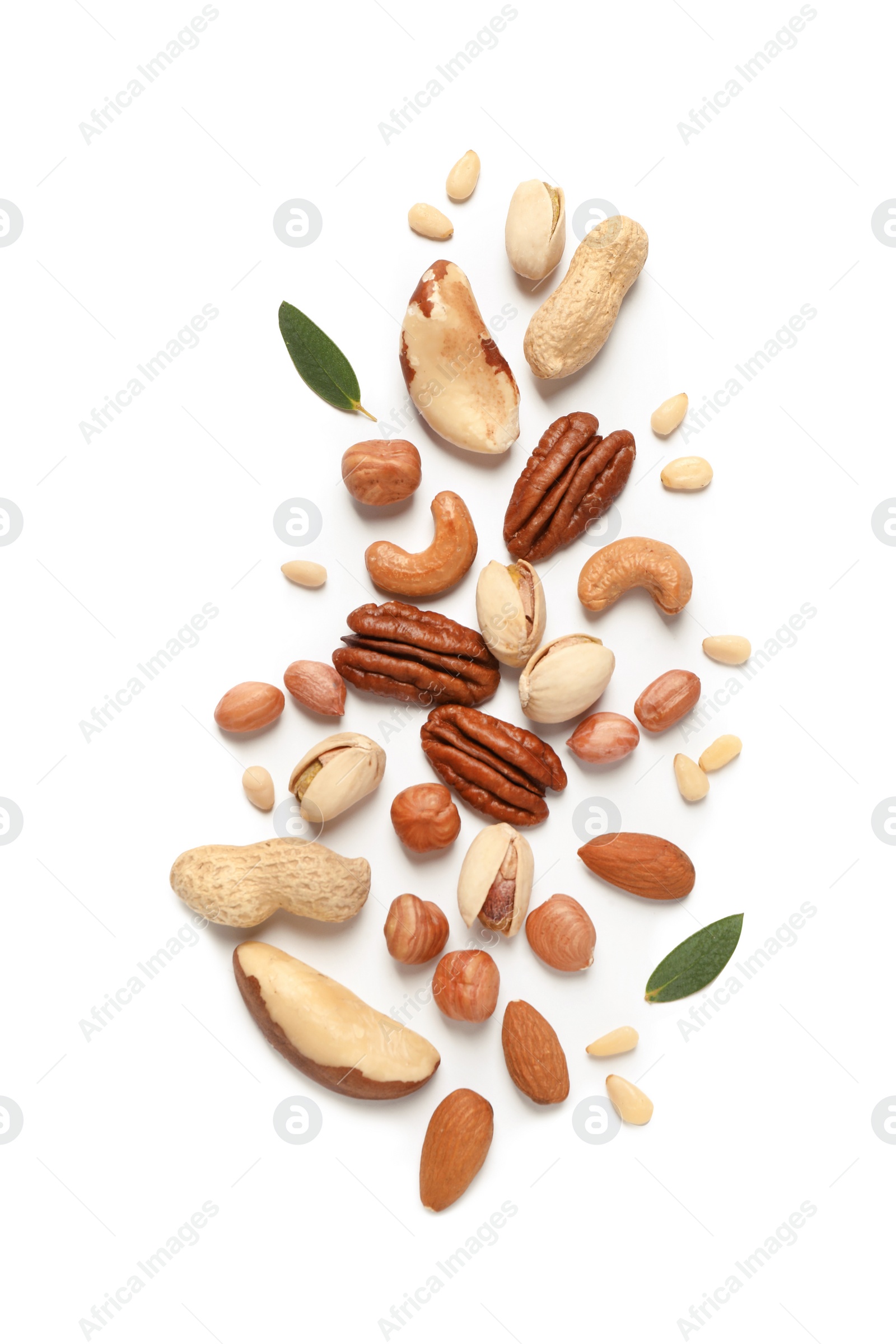 Photo of Different delicious nuts on white background, flat lay