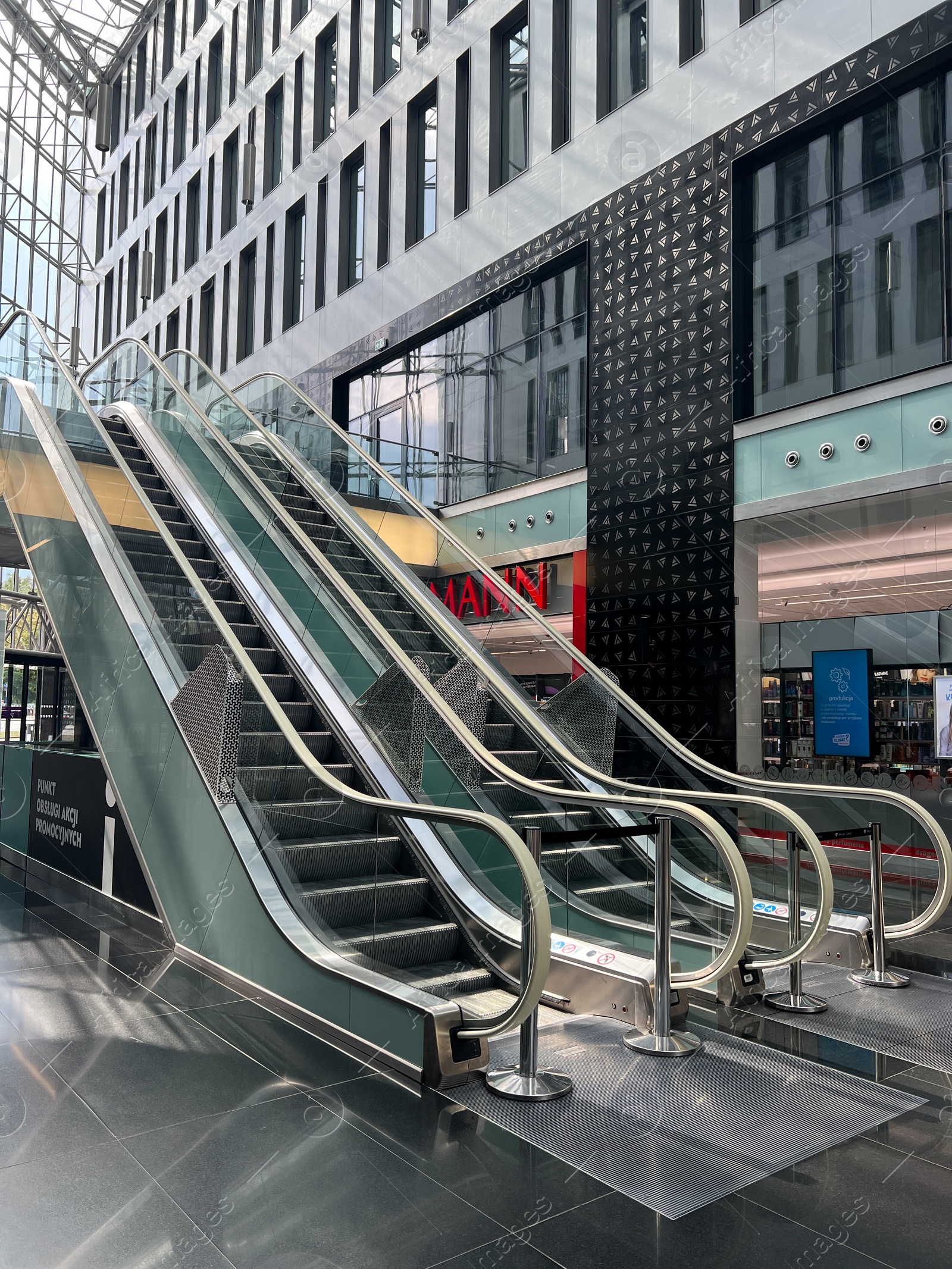 Photo of WARSAW, POLAND - JULY 23, 2022: Modern escalators in shopping mall