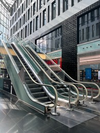 Photo of WARSAW, POLAND - JULY 23, 2022: Modern escalators in shopping mall