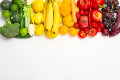 Photo of Rainbow composition with fresh vegetables and fruits on white background, flat lay