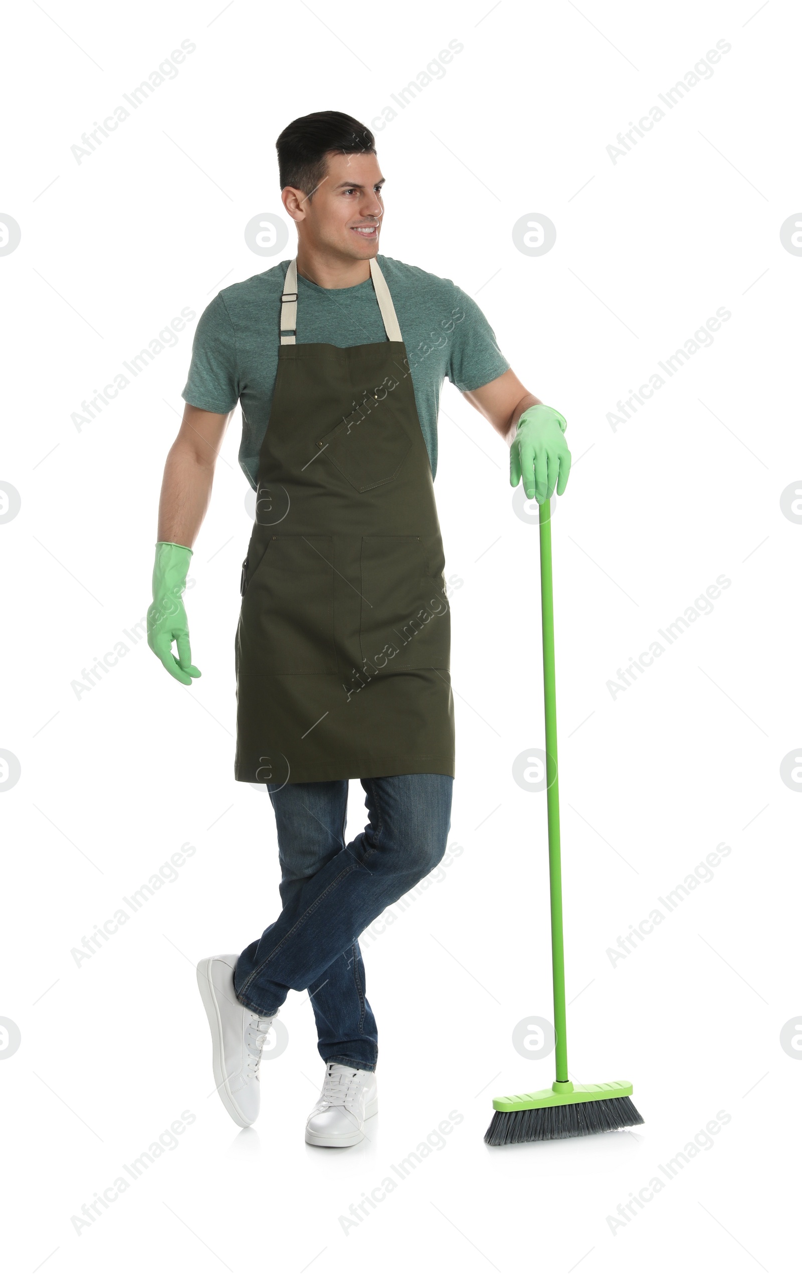 Photo of Man with green broom on white background