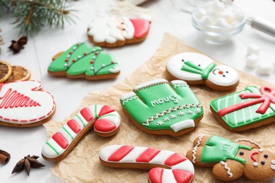 Photo of Delicious homemade Christmas cookies on white table, closeup