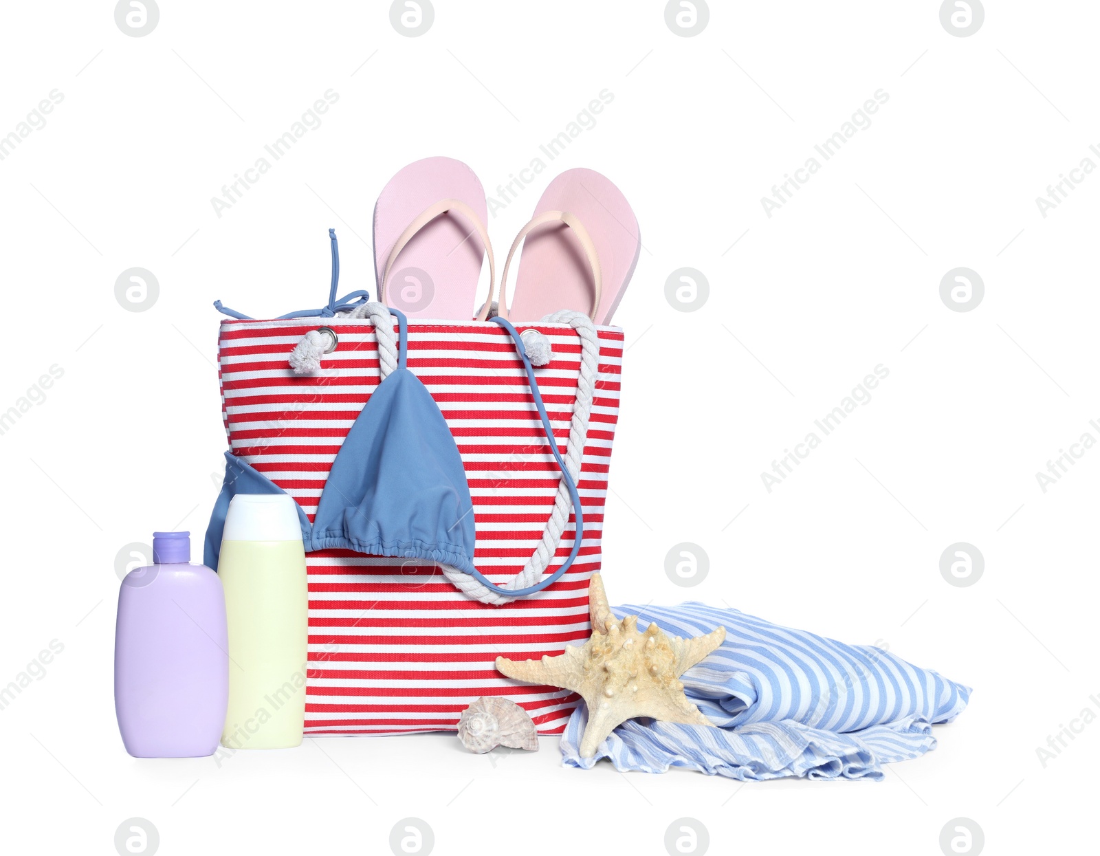 Photo of Stylish bag, skin care products and other beach accessories isolated on white