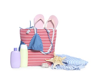 Stylish bag, skin care products and other beach accessories isolated on white