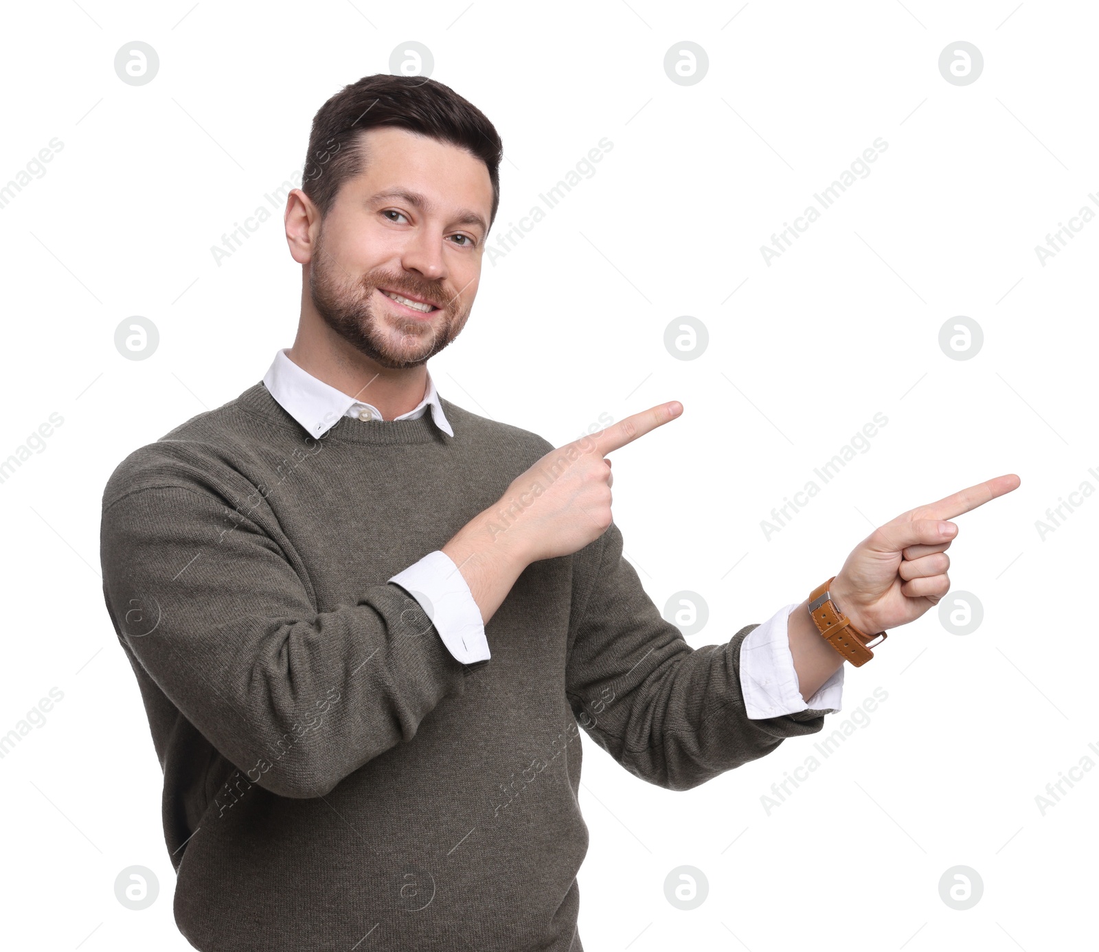 Photo of Portrait of handsome bearded businessman pointing at something on white background