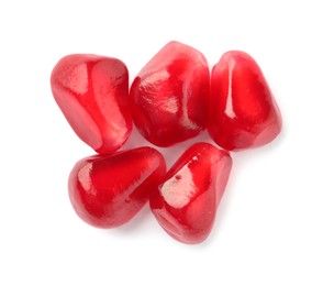 Tasty pomegranate seeds on white background, top view