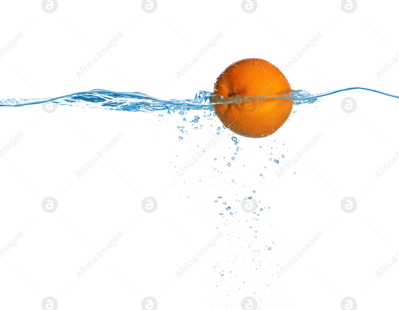 Photo of Ripe orange falling down into clear water against white background