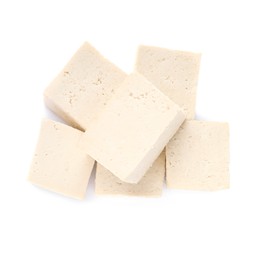 Photo of Delicious raw tofu pieces on white background, top view