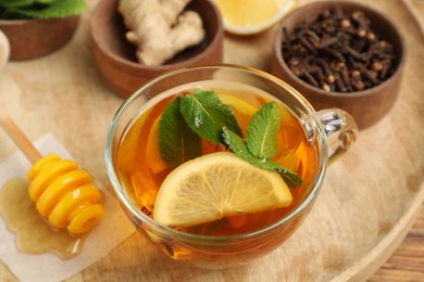 Photo of Immunity boosting drink and ingredients on wooden tray