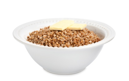 Photo of Bowl of buckwheat porridge with butter isolated on white