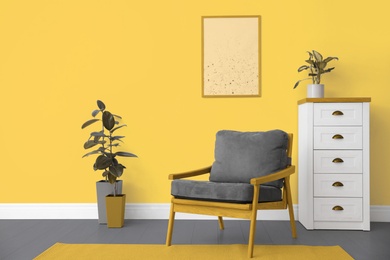 Image of Color of the year 2021. Stylish armchair and plants in room