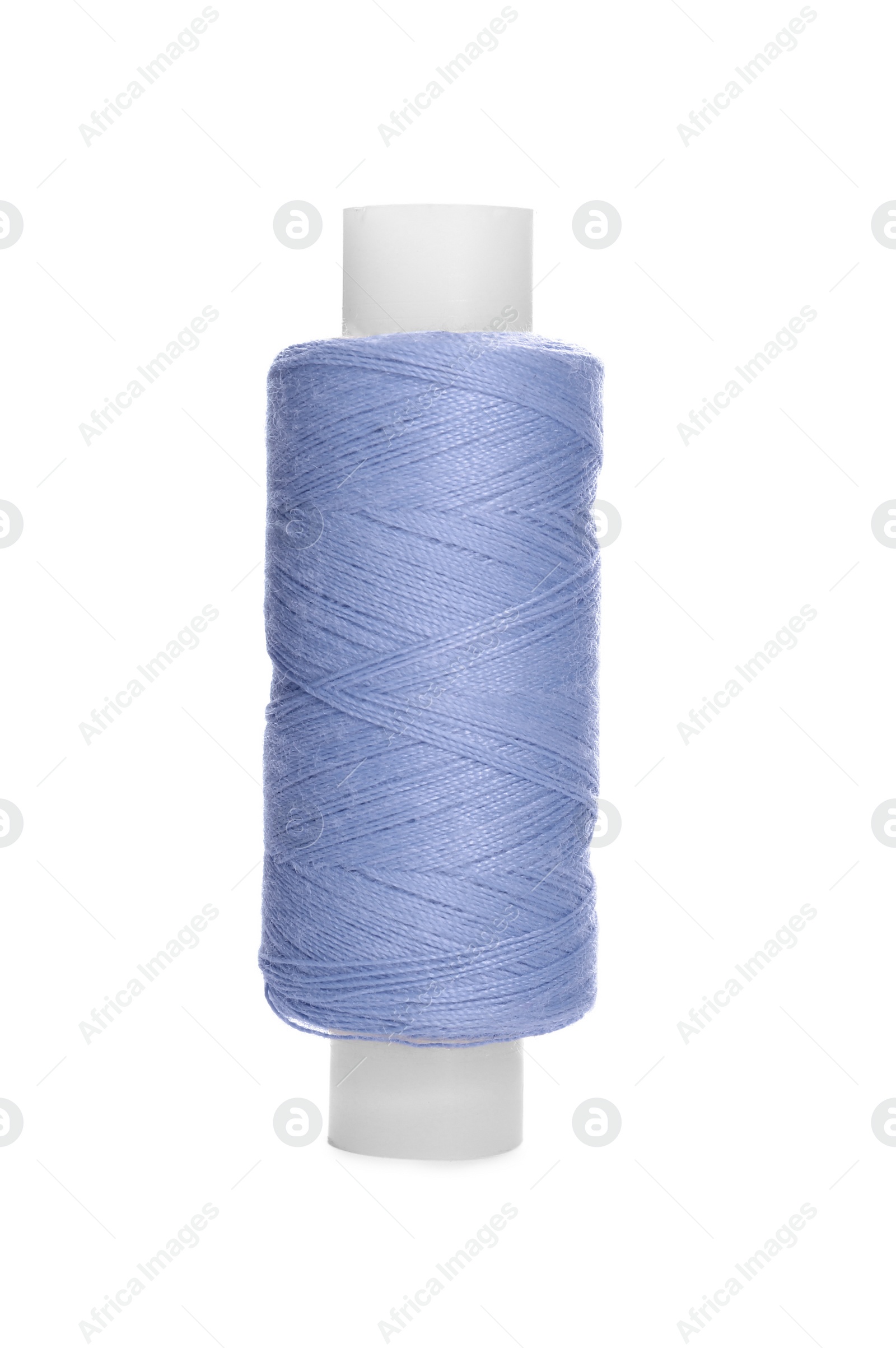 Photo of Spool of light steel blue sewing thread isolated on white