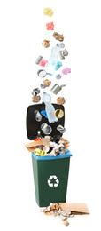 Image of Different garbage falling into trash bin. Waste management and recycling