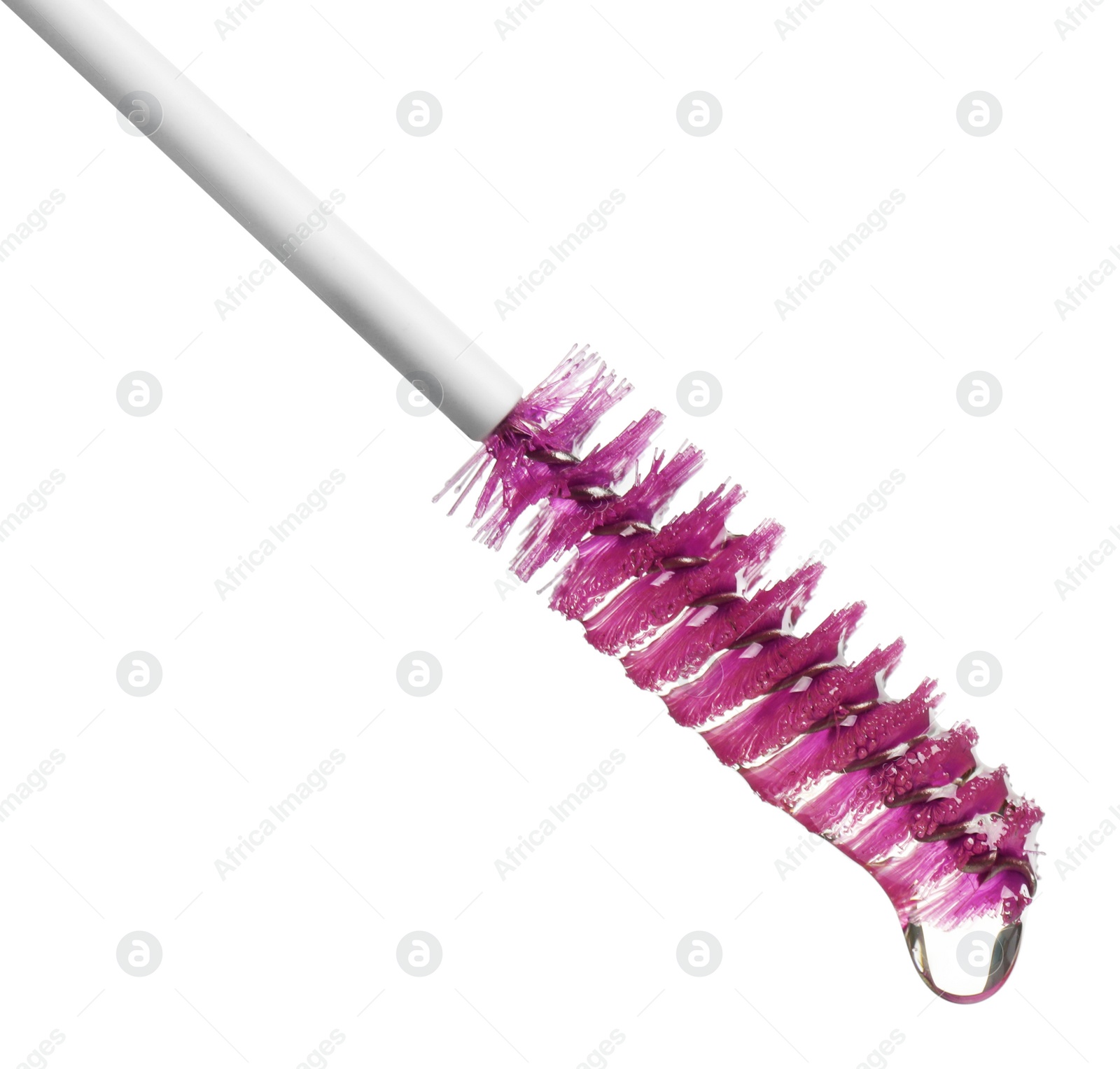 Photo of Drop of eyelash oil falling down from brush on white background