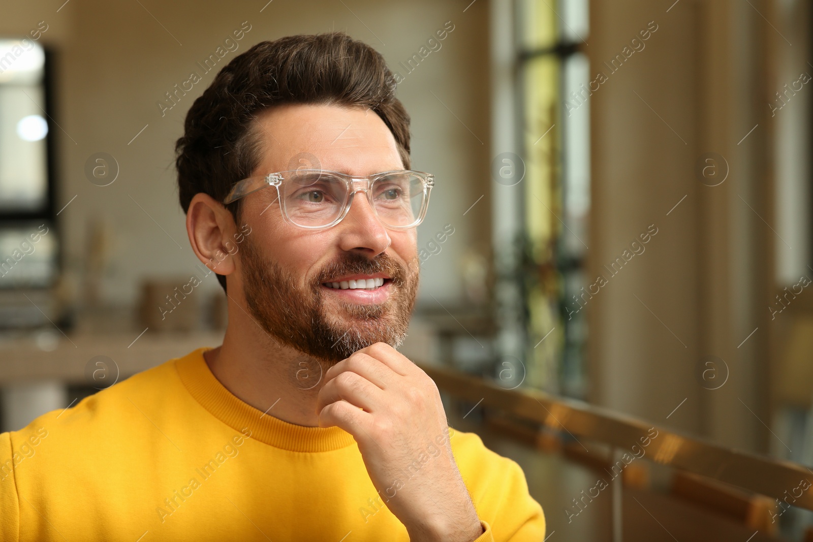 Photo of Portrait of handsome stylish man in office