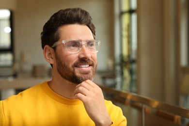 Portrait of handsome stylish man in office