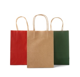 Photo of Mockup of paper shopping bags on white background