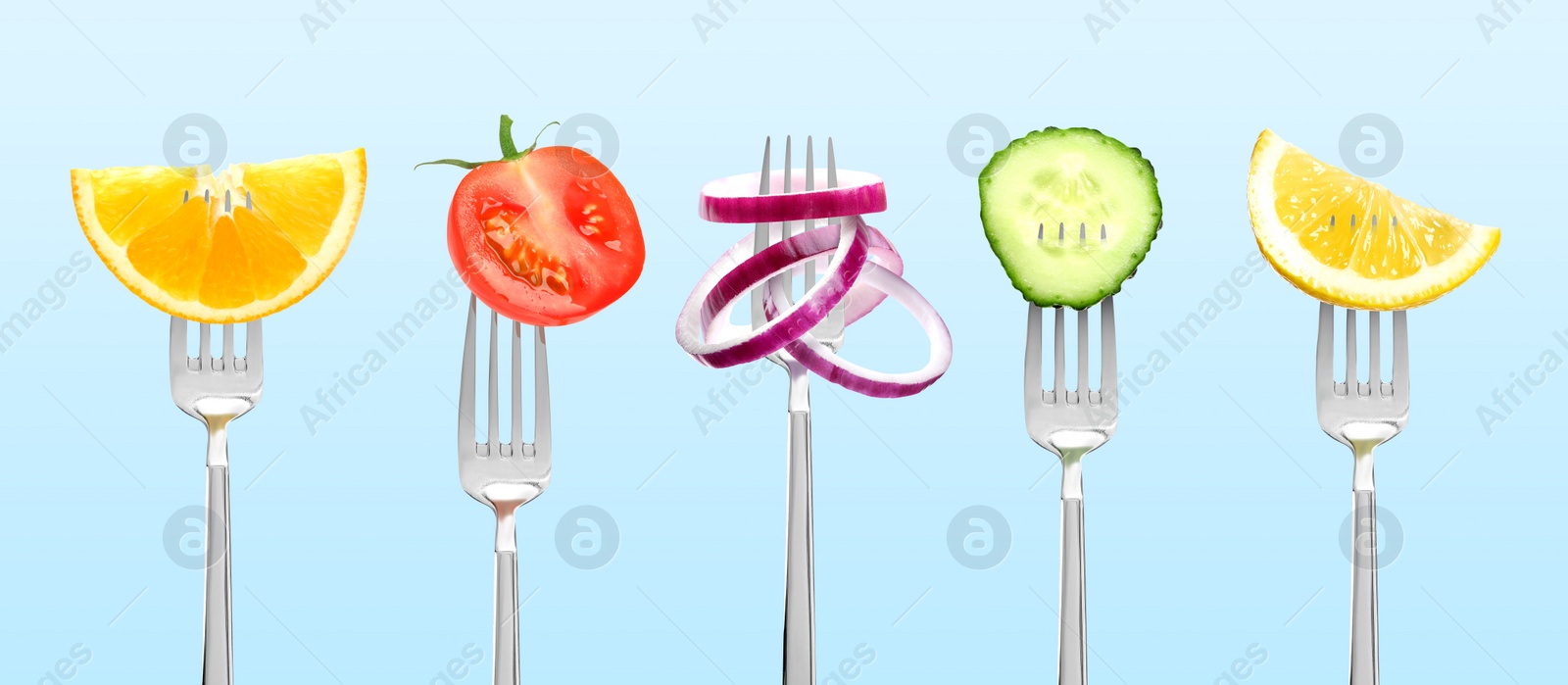 Image of Forks with different food products on light blue background, collection