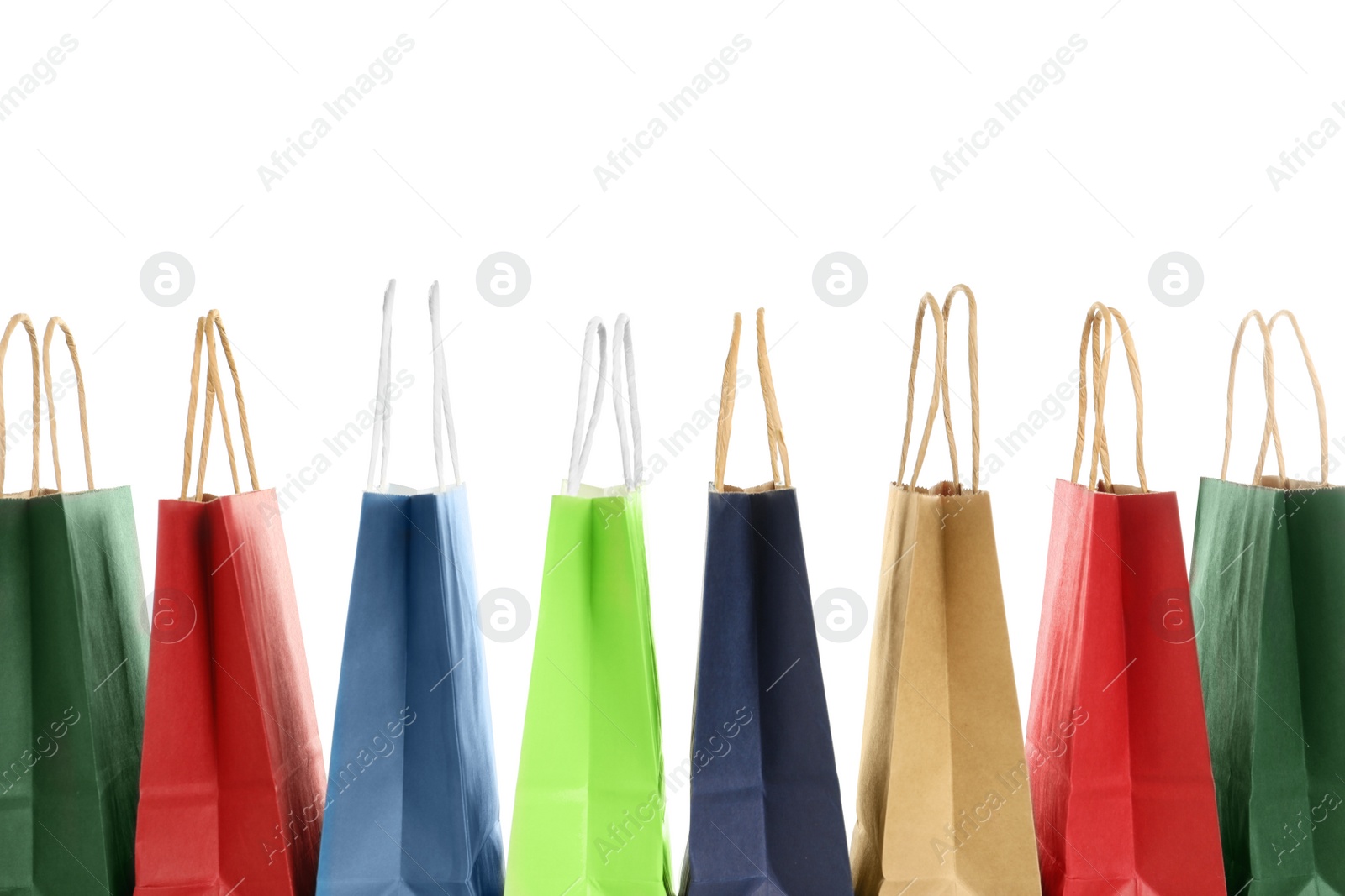 Photo of Colorful paper shopping bags on white background