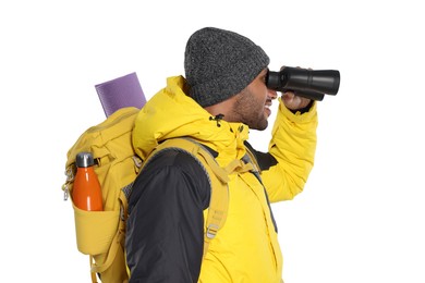 Photo of Happy tourist with backpack looking through binoculars on white background