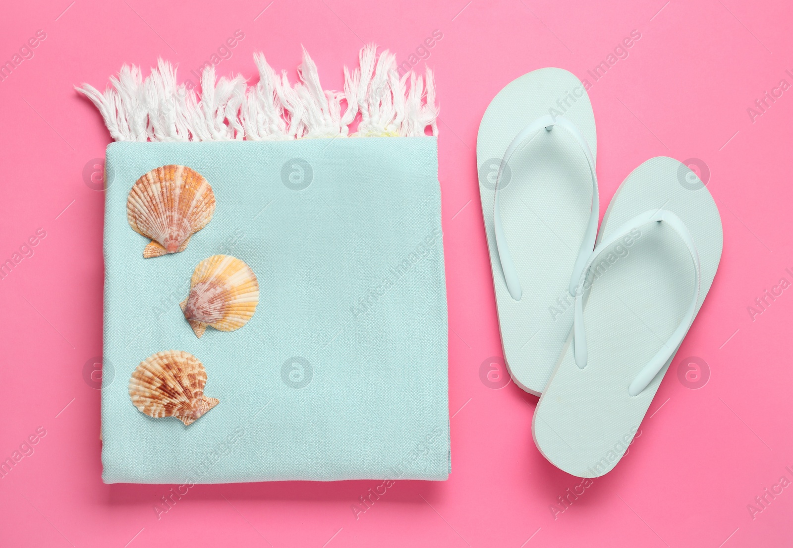 Photo of Flat lay composition with different beach objects on pink background