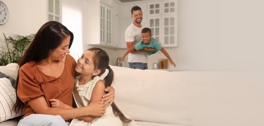Image of Happy family with children having fun at home, space for text. Banner design