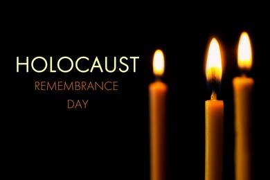 Image of International Holocaust Remembrance Day. Burning candles on black background