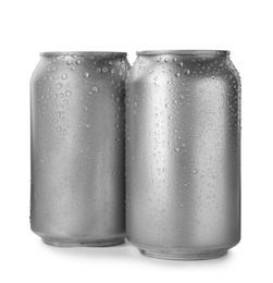 Aluminum cans of beverage covered with water drops on white background. Space for design