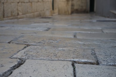 Photo of View of street tiles in town. Alleyway covering