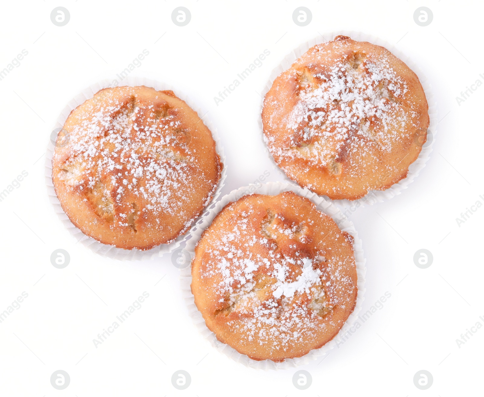 Photo of Tasty muffins powdered with sugar on white background, top view