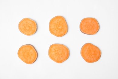 Photo of Composition with slices of sweet potato on white background, top view