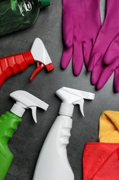 Photo of Many different car cleaning products on dark background, flat lay