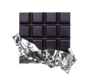 Delicious dark chocolate bar wrapped in foil isolated on white